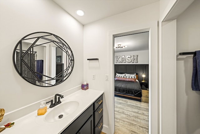 bathroom featuring oversized vanity and hardwood / wood-style flooring