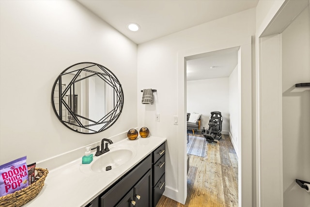 bathroom with vanity and hardwood / wood-style flooring