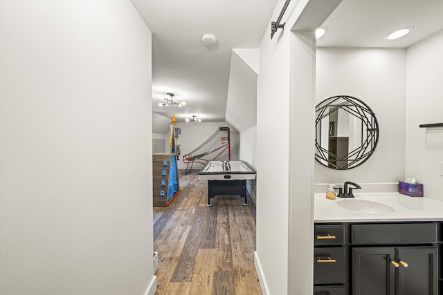 bathroom featuring vanity and wood-type flooring