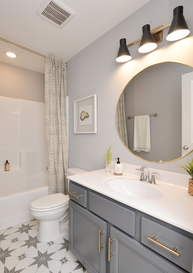 full bathroom featuring shower / bath combo with shower curtain, toilet, vanity, and tile flooring