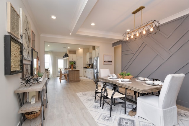 dining area featuring light hardwood / wood-style flooring, crown molding, beamed ceiling, and a chandelier