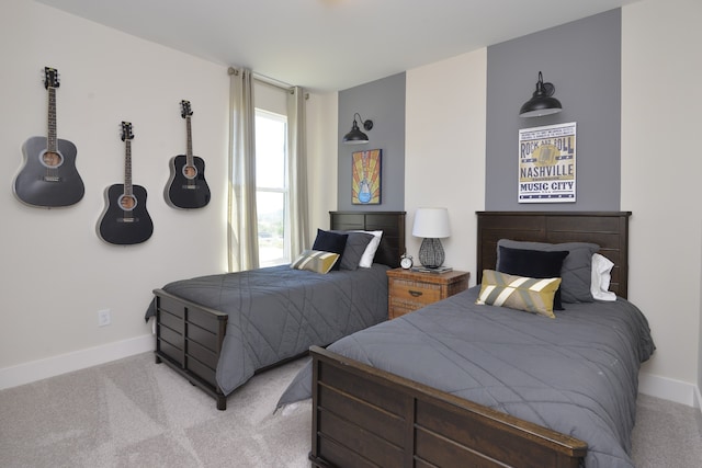 bedroom featuring light colored carpet