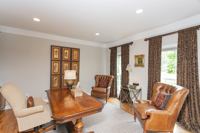 home office featuring ornamental molding and light hardwood / wood-style floors