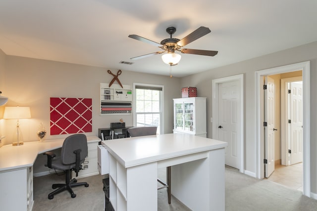 office space with light carpet and ceiling fan