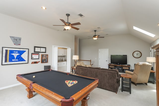 rec room featuring light carpet, lofted ceiling with skylight, ceiling fan, and pool table