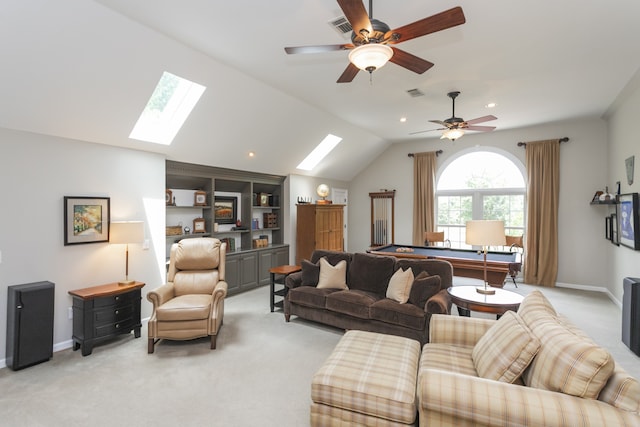 living room featuring vaulted ceiling with skylight, pool table, ceiling fan, and light colored carpet