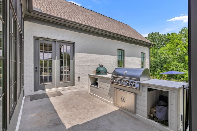 view of patio / terrace featuring area for grilling and an outdoor kitchen