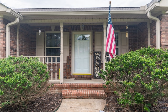 property entrance featuring a porch