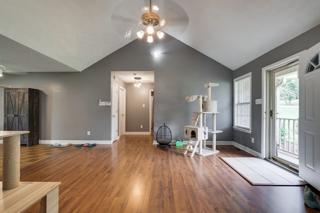 entryway with lofted ceiling, ceiling fan, and light wood-type flooring