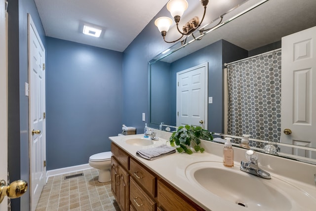 bathroom featuring toilet, vanity with extensive cabinet space, tile floors, dual sinks, and an inviting chandelier