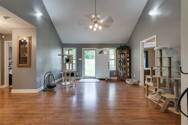 entryway featuring ceiling fan, dark wood-type flooring, and high vaulted ceiling