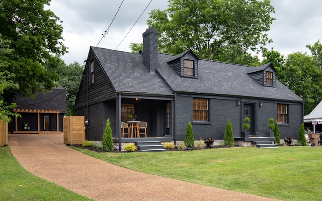 view of front of house featuring a front yard and a porch