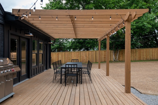 deck featuring a patio area and a pergola