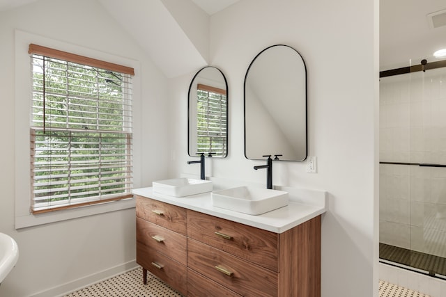 bathroom with a healthy amount of sunlight, tile flooring, and oversized vanity