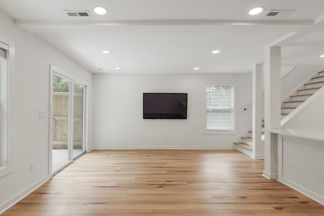 unfurnished living room featuring light hardwood / wood-style flooring