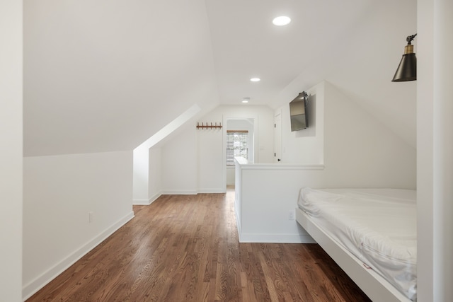 unfurnished bedroom with dark hardwood / wood-style floors, vaulted ceiling, and billiards