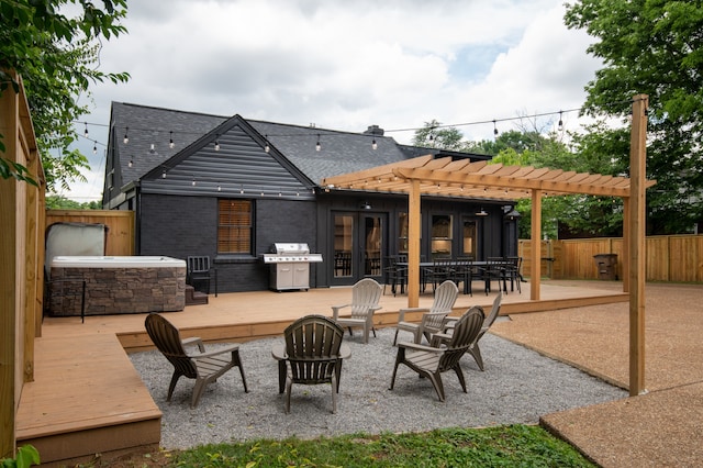 back of property with a pergola and a patio area