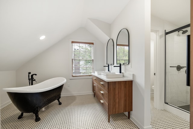 bathroom with lofted ceiling, a wealth of natural light, vanity, and independent shower and bath