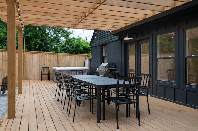 wooden terrace featuring grilling area and french doors