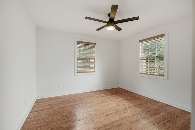 unfurnished room featuring ceiling fan and light wood-type flooring