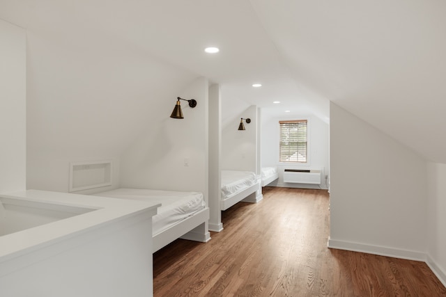 interior space with lofted ceiling and dark wood-type flooring