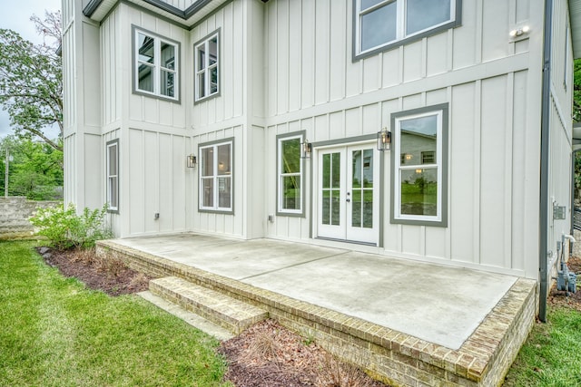 rear view of house featuring a yard and a patio