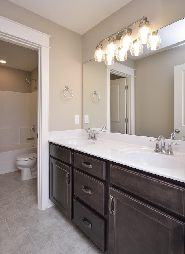 full bathroom featuring shower / bathing tub combination, toilet, dual vanity, and tile floors