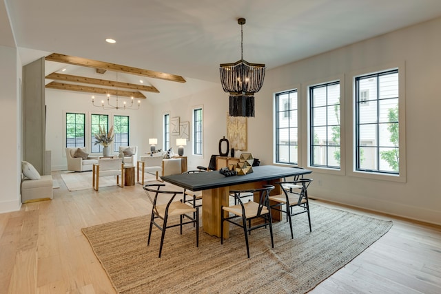 dining room with a chandelier, plenty of natural light, light wood-type flooring, and beamed ceiling