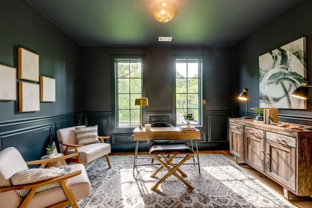 sitting room featuring light hardwood / wood-style flooring