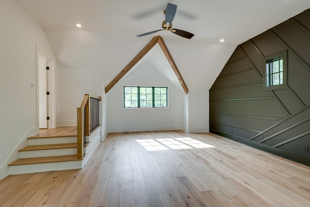 bonus room featuring light hardwood / wood-style floors, ceiling fan, and vaulted ceiling