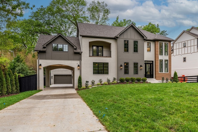 view of front of property with a front yard and a garage