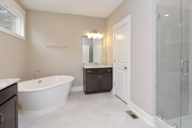 bathroom with vanity, plus walk in shower, and tile floors