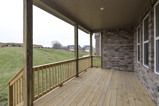 wooden deck with a yard