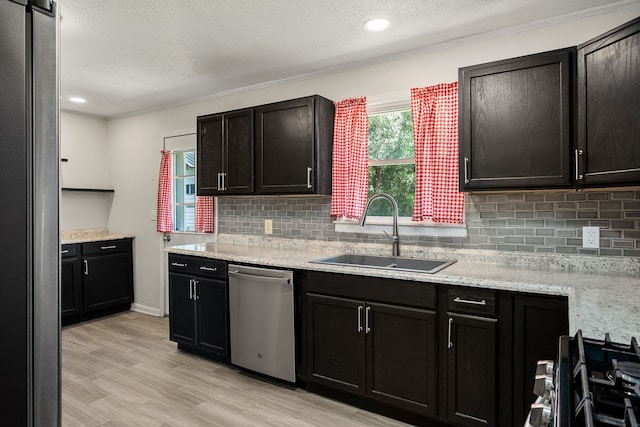 kitchen featuring light hardwood / wood-style flooring, sink, light stone counters, and stainless steel appliances