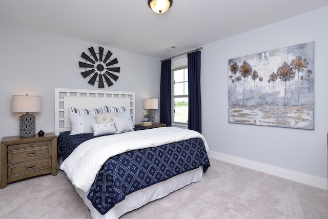 bedroom featuring light colored carpet