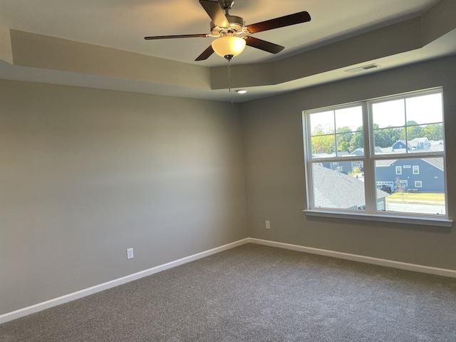 unfurnished room with carpet flooring and ceiling fan