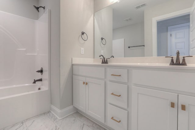 bathroom featuring dual sinks, tile flooring, washtub / shower combination, and vanity with extensive cabinet space