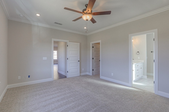 unfurnished bedroom featuring light carpet, ensuite bath, crown molding, and ceiling fan