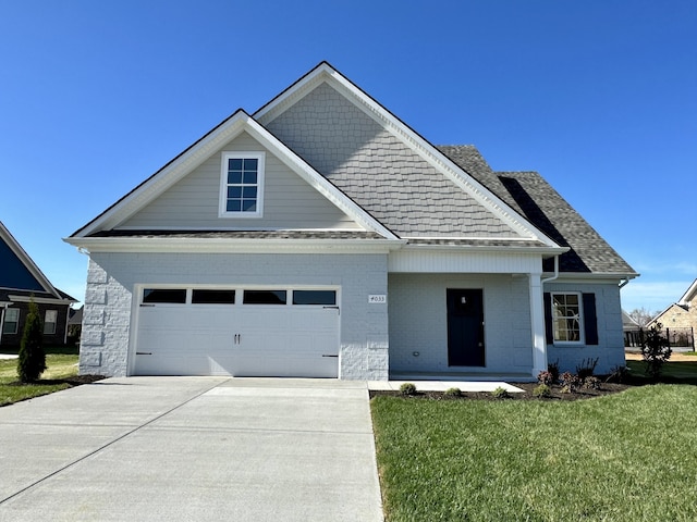 craftsman house with a front yard and a garage