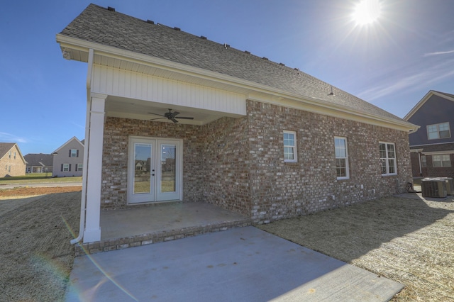 rear view of house with a patio, ceiling fan, french doors, and central AC