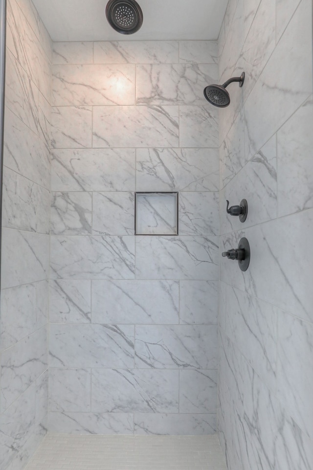 bathroom featuring tiled shower