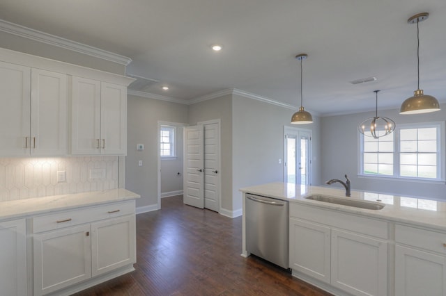 kitchen featuring white cabinetry, hanging light fixtures, dark hardwood / wood-style floors, sink, and stainless steel dishwasher