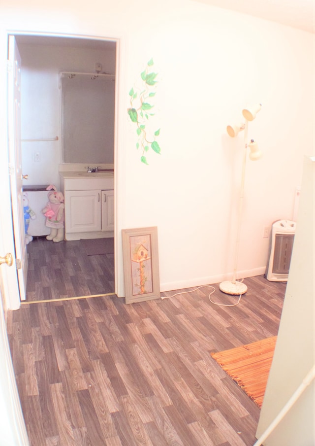 interior space featuring sink and hardwood / wood-style flooring