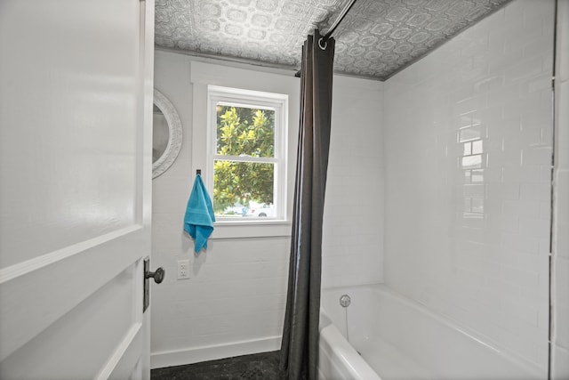 bathroom featuring shower / bath combo with shower curtain