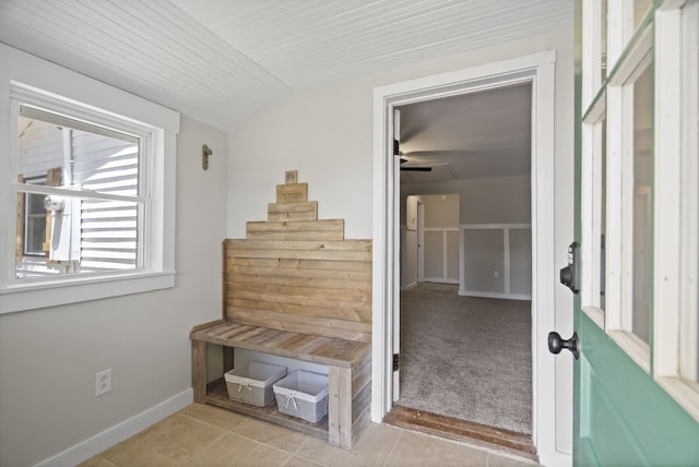 mudroom with ceiling fan and light carpet