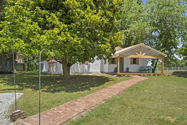 exterior space featuring a shed and a front yard