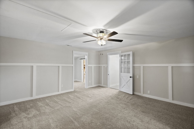 carpeted empty room featuring ceiling fan