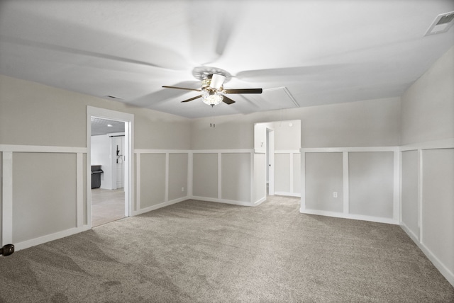 additional living space with ceiling fan and light colored carpet