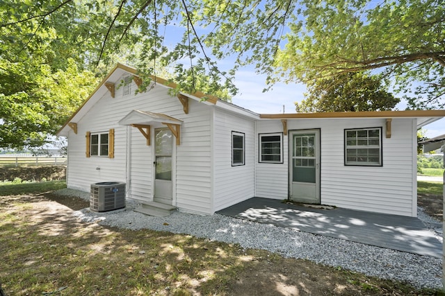 rear view of property featuring central AC