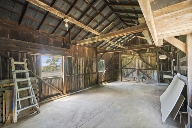 miscellaneous room with plenty of natural light and vaulted ceiling